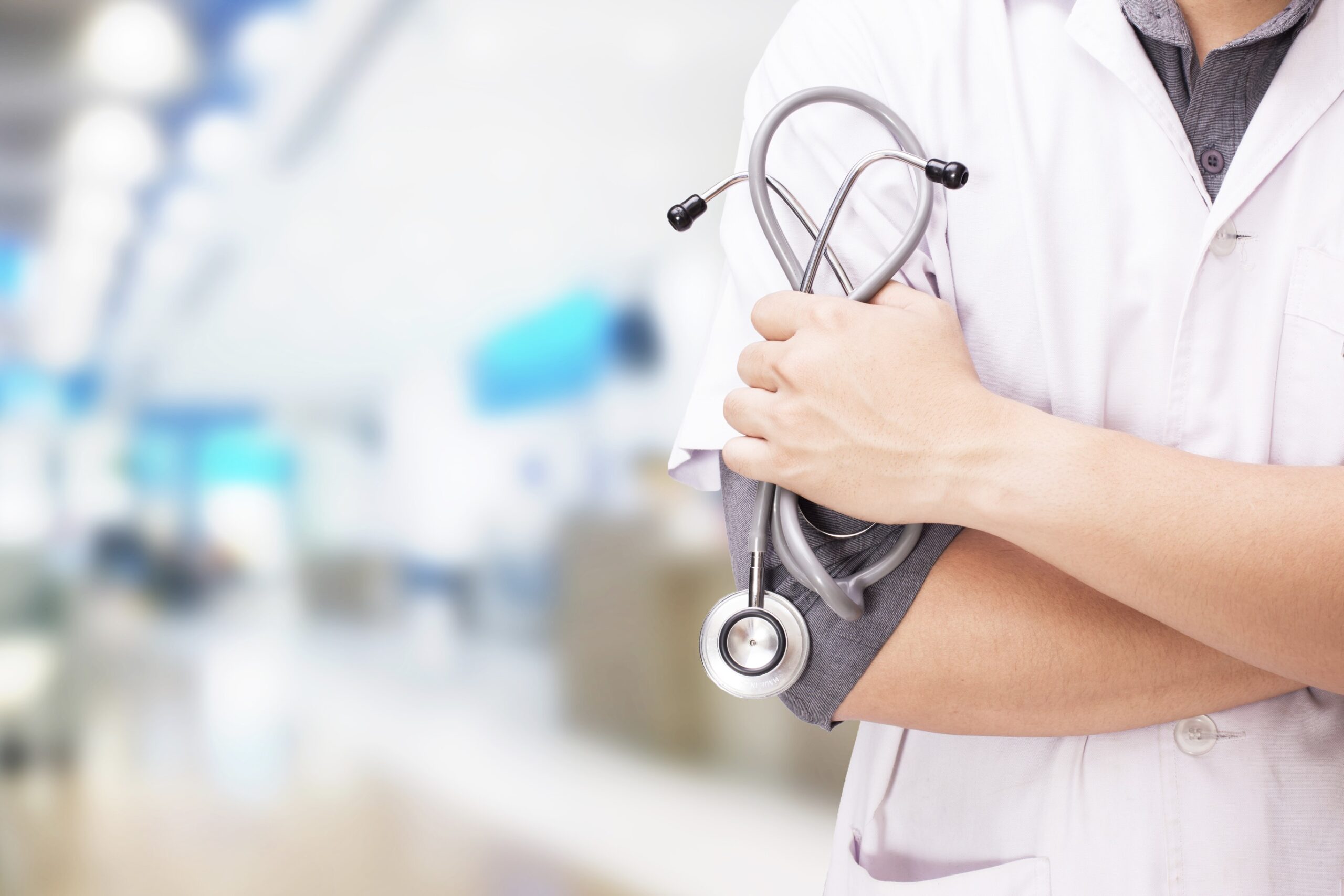doctor with stethoscope hands hospital background