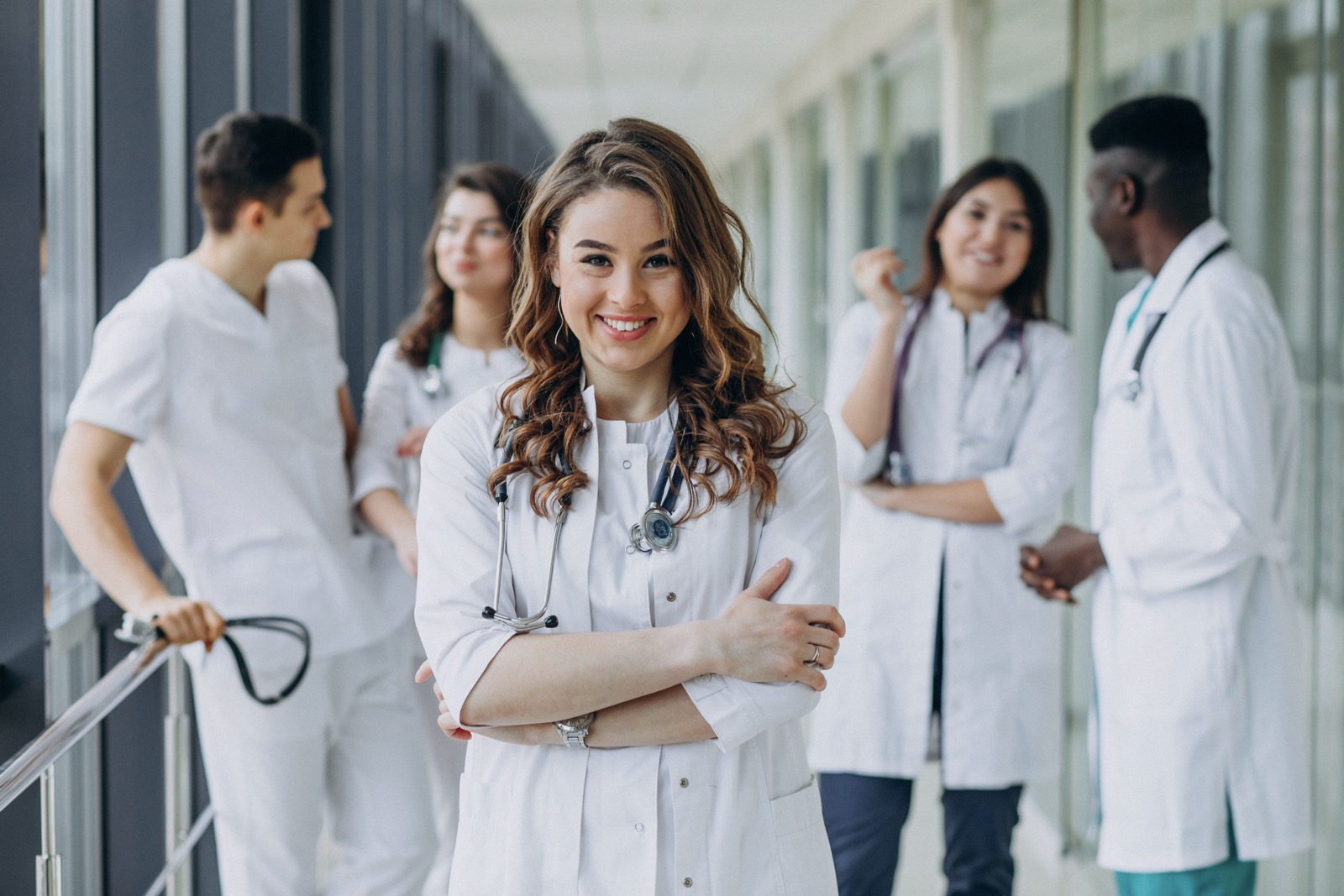 young female doctor posing corridor hospital
